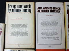 7 VINTAGE ALDOUS HUXLEY PAPERBACK BOOKS: BRAVE NEW WORLD, ISLAND, APE & ESSENCE