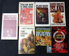 7 VINTAGE ALDOUS HUXLEY PAPERBACK BOOKS: BRAVE NEW WORLD, ISLAND, APE & ESSENCE