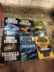 Clive Cussler Hardcover Books Lot of 27 See Photos for Titles Excellent Conditio