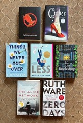 Lot of 7 Popular Books – Lucy Score, Kate Quinn, Suzanne Collins – gently used
