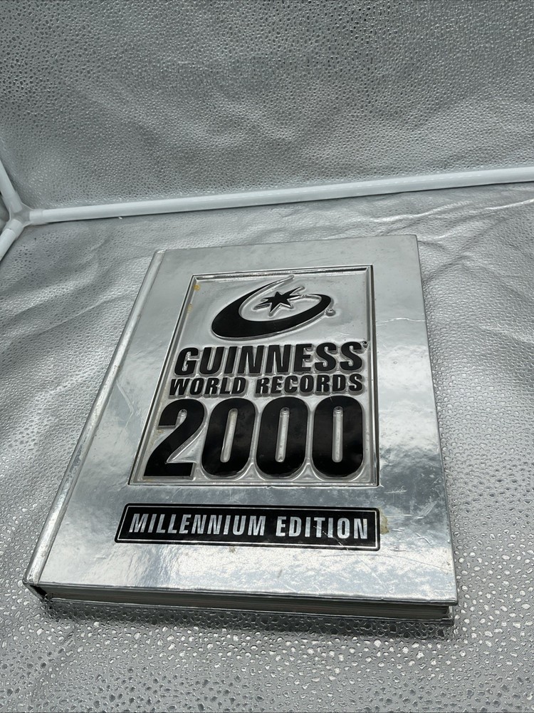 Vintage Guinness Book Of World Records 2000 Millennium Edition Silver Hard Cover