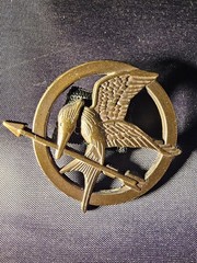 The World of the Hunger Games Book Combo w/Rue Poseable Figure & Mockingjay