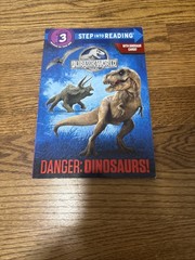 Danger: Dinosaurs! (Jurassic World) (Step into Reading) – Paperback – VERY GOOD