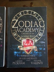 Zodiac Academy Books 0.5 And 5.5 In The Original Matte Black Covers.