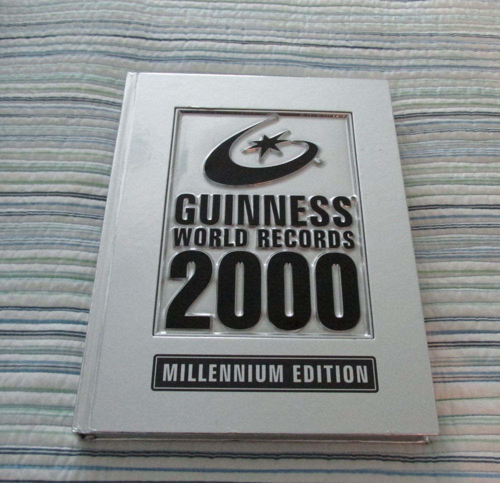 Vintage Guinness Book Of World Records 2000 Millennium Edition Silver Hard Cover