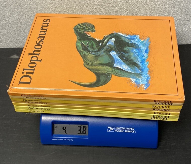 Vintage Rourke Dinosaur Library 7 Books Yellow Orange Peach Decorative Bookshelf