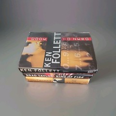 Lot of 3 Brad Taylor, Ken Follett and John Grisham hardcover books As Shown