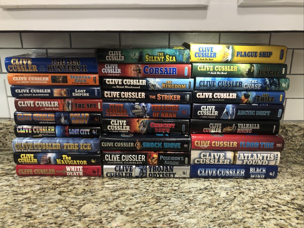 Clive Cussler Hardcover Books Lot of 27 See Photos for Titles Excellent Conditio